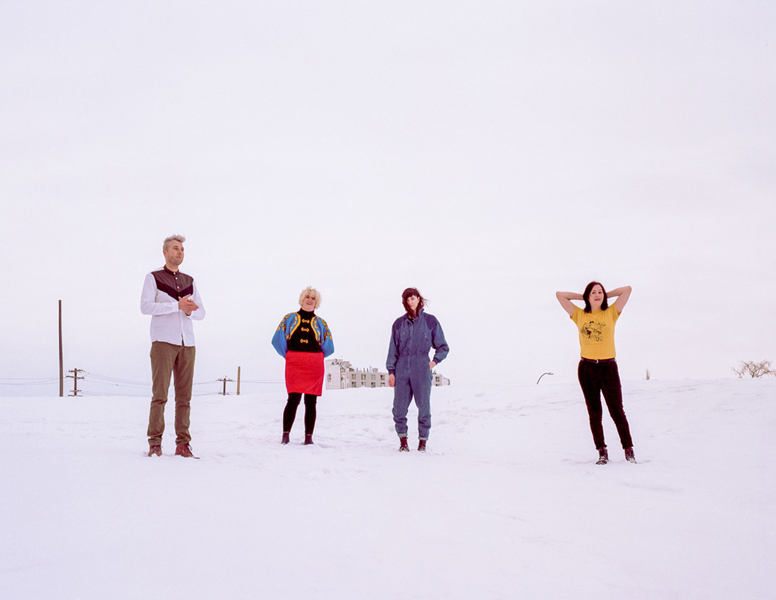 Wares band members standing in snow