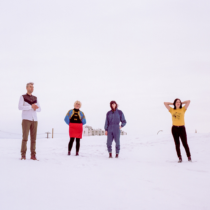Wares band members standing in snow