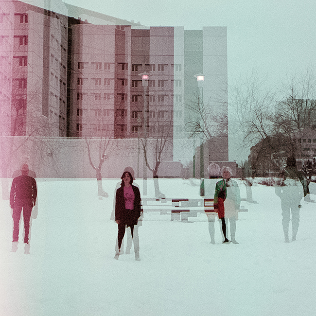 Wares band members with buildings in background