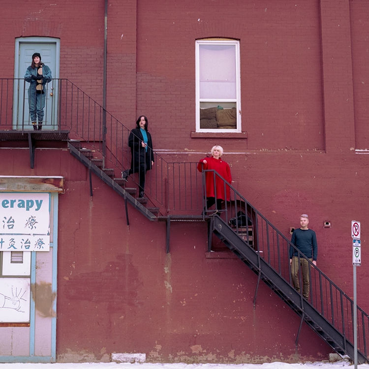 Wares band members standing on staircase